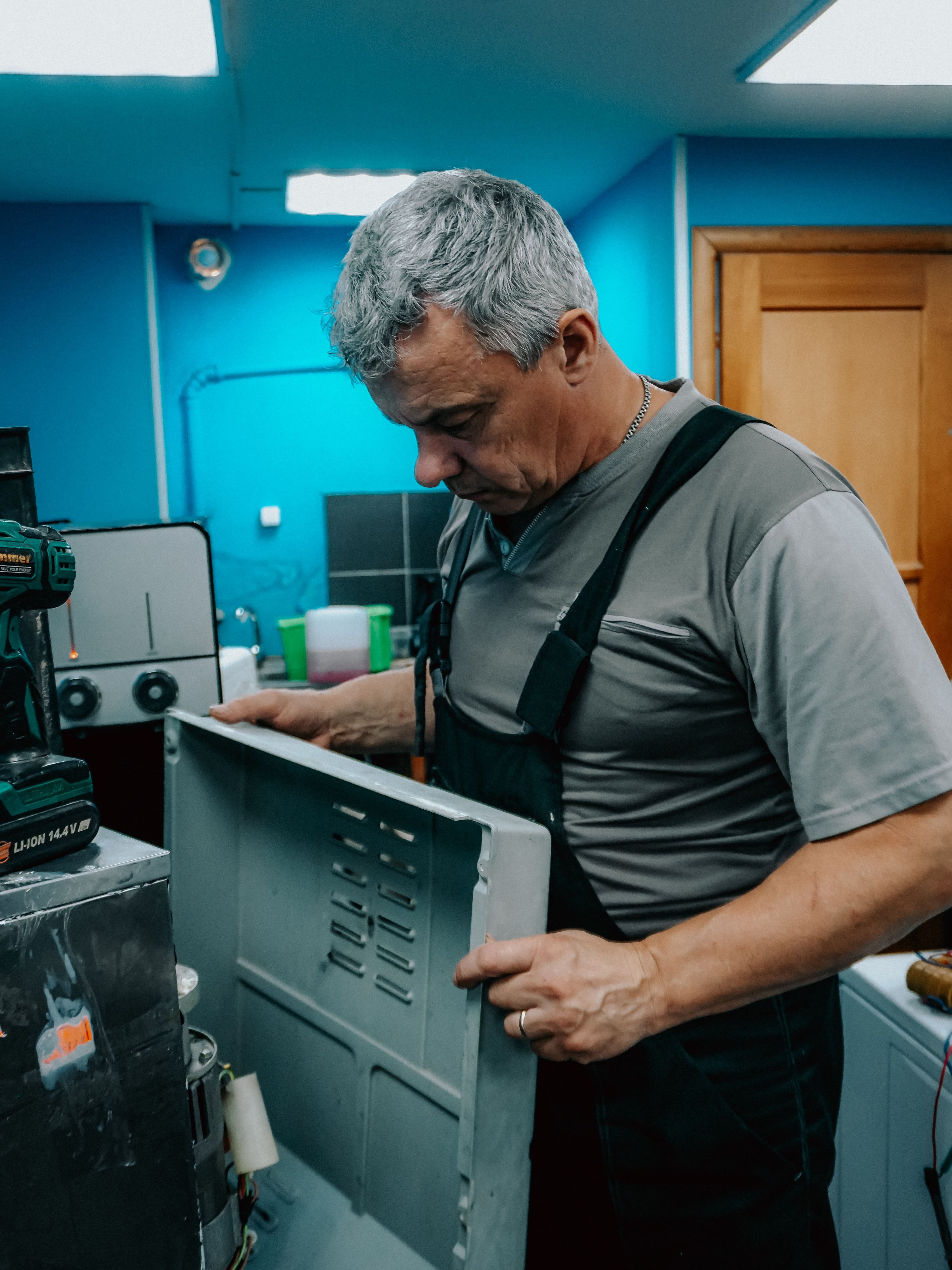 Ark Appliance Services technician diagnosing an appliance in a Mandarin, FL home